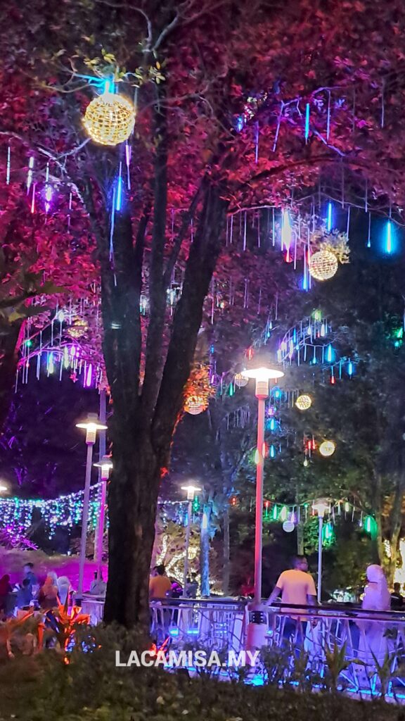 The ever changing raining-like neon light hanging on the trees captivates peoples eyes in Secret Garden Putrajaya