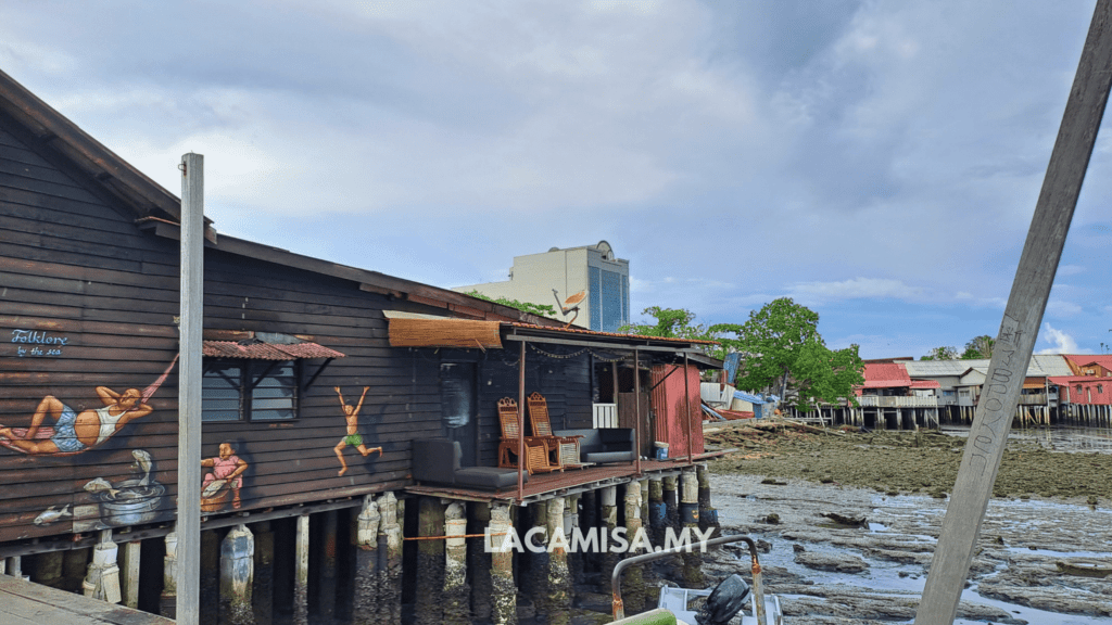 Traditional wooden houses on stilts above the water, makes up the uniqueness of Chew Jetty, Penang