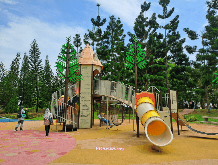 Parents can rest at the swings underneath the slides in Taman Saujana Hijau playground