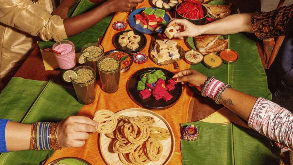 Must-have foods during Deepavali include murukku, laddoos, and gulab jamun, which symbolize joy and are shared as part of the festive celebration.