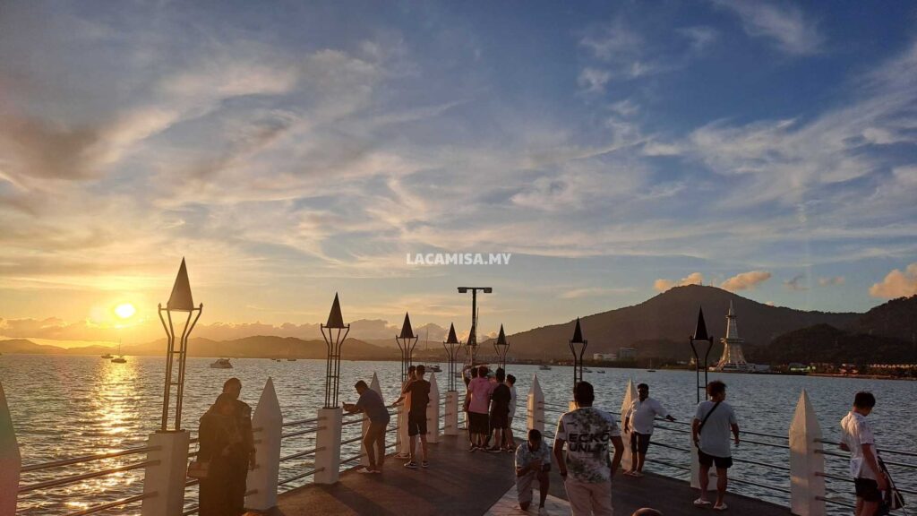 Tourists relax along the walkways, enjoying the gentle sea breeze and coastal views.