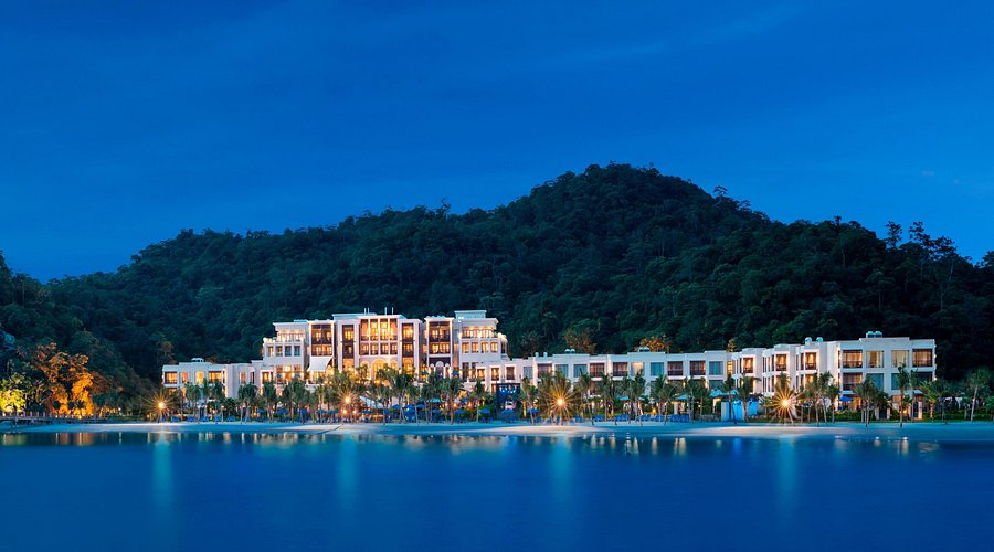 The St. Regis Langkawi overwater villas illuminated during sunset (Image credited to TripAdvisor.com).