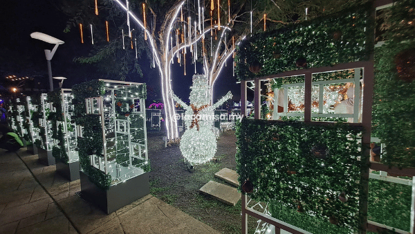 Illuminated snowman, perfect backdrop for Instagram-worthy photos.