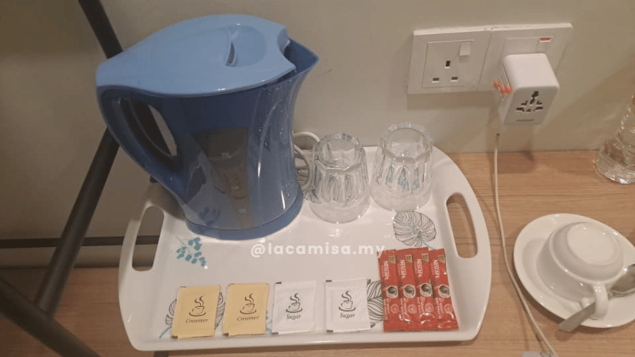 Neatly organized tea pouchs and nescafes 